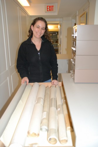 Melissa Bronheim processing architectural drawings from the H. A. DeCosta Papers.