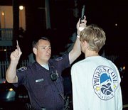 Charleston Sr. Police Officer Matthew Wojslawowicz administers a field sobriety test to a driver. He was testing for horizontal gaze nystagmus, an involuntary jerking of the eyes as a result of intoxication.
