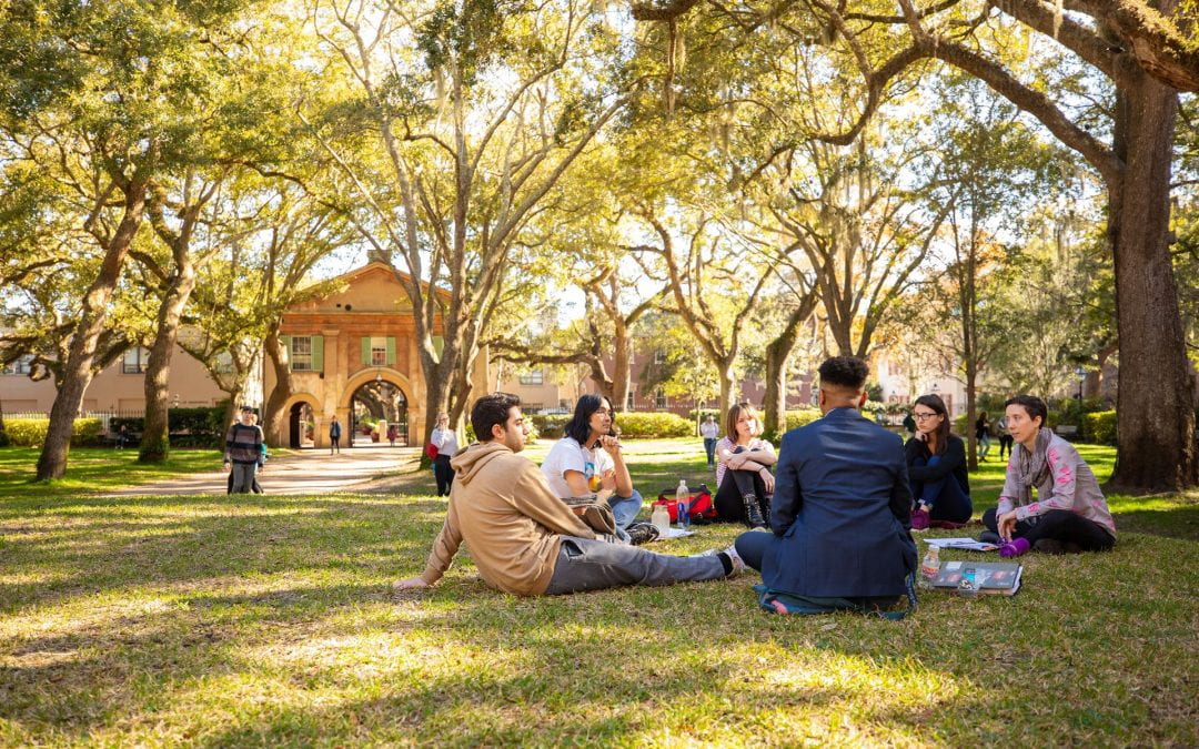 Students sitting in a circle in The Cistern Yard