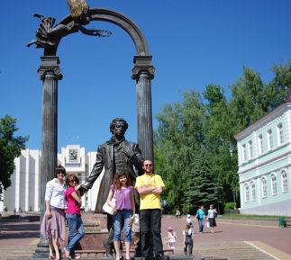 In front of a statue of Pushkin