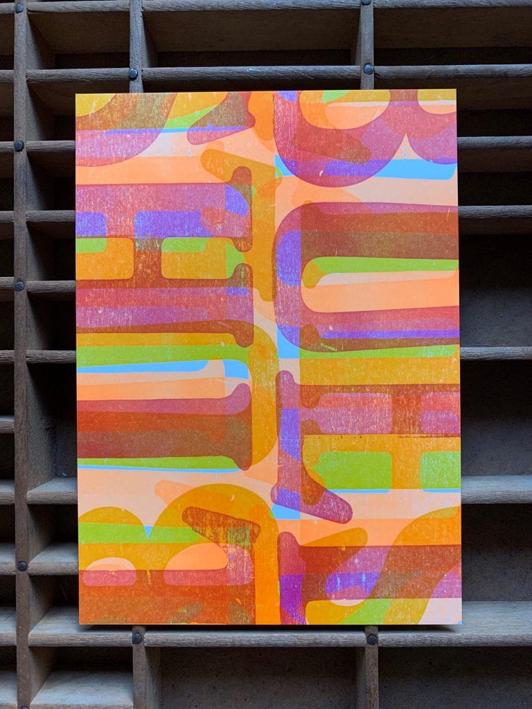 Letterpress print made of overlapping, colorful letterforms spelling out the word "BULLSHIT"